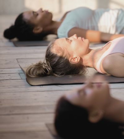 Women doing yoga for holistic health